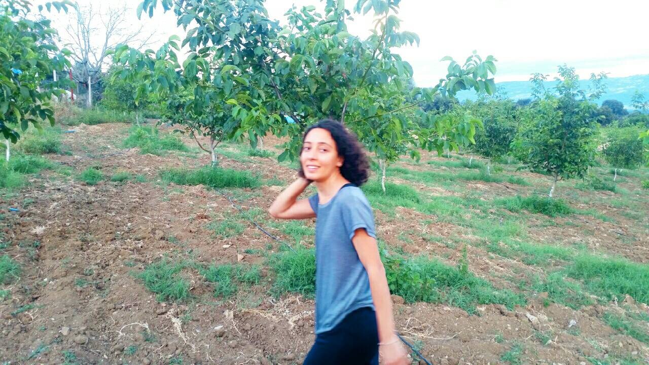 Aslihan Selimbeyoglu, on her family's walnut farm in Turkey